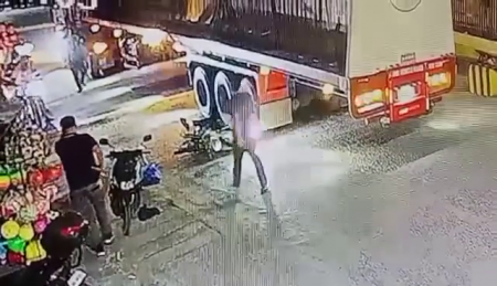 A Woman On A Motorcycle Fell Headfirst Between The Wheels Of A Truck In A Flat Spot