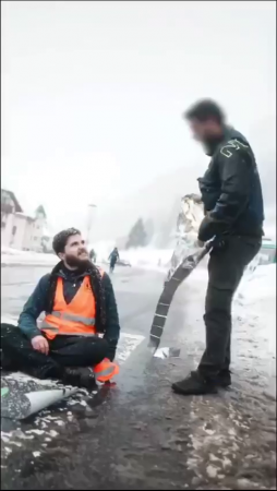 🤪 German Police Officers Cover Global Warming Activists With Blankets