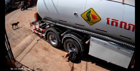 A Woman Lay Under The Wheels Of A Huge Tanker Truck