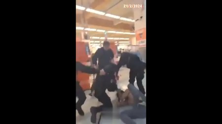 Woman Defend Young Man Against Four Security Guards