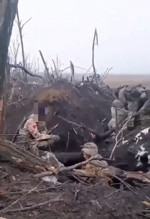 A Russian Soldier Shakes The Hand Of A Captured Ukrainian Soldier To Calm Him Down