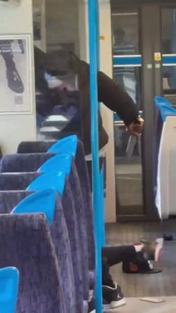 A Man With A Knife  Attacking A Person On The Train. England