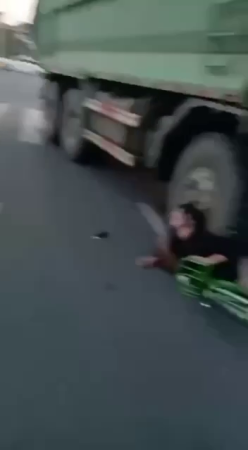 Young Woman Under The Wheel Of A Truck. Will Probably Survive