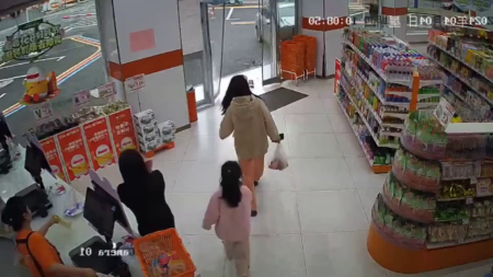 A Car Accident Hit A Woman With A Child Near A Supermarket
