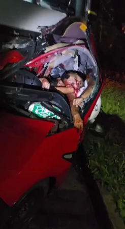 Warped And Flattened In The Mangled Car, The Driver And His Passenger