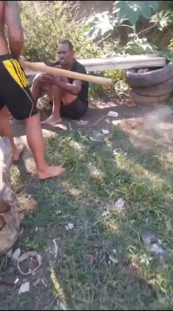 The Dude Is Mercilessly Beaten With A Stick.he Probably Stole Something