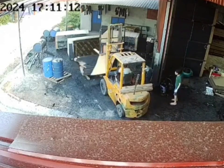 The Worker Is Flattened By Plywood Sheets That Fell From The Loader