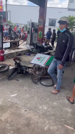 A Dude On A Motorcycle Flew Into A Gas Station. Vietnam
