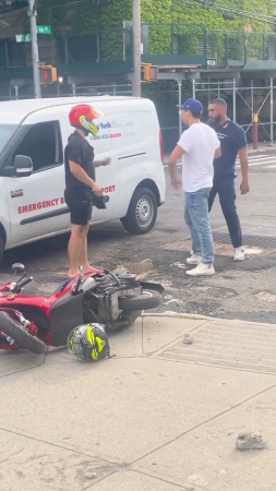 Motorcyclist Demonstrates Importance Of Protective Headgear To Angry Driver. NY, USA