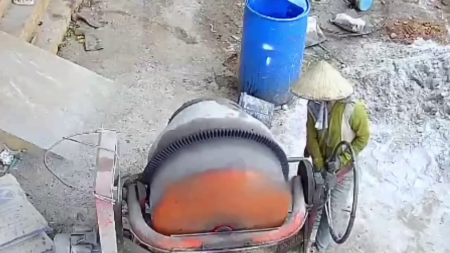 A Woman Preparing Cement Mortar Died From Electric Shock From A Concrete Mixer. Vietnam