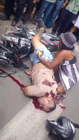 A Woman Sobs Over The Body Of Her Husband Shot Dead On The Street By Criminals