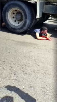 A Guy Under The Wheels Of A Truck Begs For Help