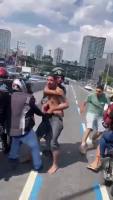 A Crowd Of Young Men On The Road Beats Up The Dude Who Caused The Accident