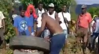 Haitians Preparing To Cook Some Meat